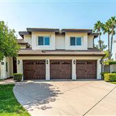 Large Single family suburban home with a spanish style design