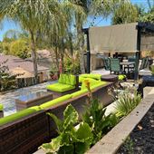 Contemporary Hillside home with Tropical graded patio