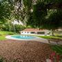 Vintage Hollywood Vibes – Secluded Palm-Lined Mid-Century Pool Oasis Wrapped In Lush Greenery – A Filmmaker’s Dream!