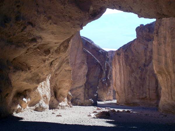 Badwater Basin - Death Valley National Park (10/22/2007 - Credits: "Looking through the Natural Bridge off Badwater Valley in Death Valley, CA (devils32xy)" by Matthew Lee High (CC BY-NC 2.0)[https://creativecommons.org/licenses/by-nc/2.0/legalcode]https://www.flickr.com/photos/matthigh/)