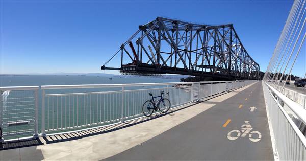 San Francisco-Oakland Bay Bridge - Highway 80 - Pedestrian Walkway & Bike Path (7/6/2014 - Credits: "Oakland Bridge Ride" by Phil King (CC BY-NC-ND 2.0)[https://creativecommons.org/licenses/by-nc-nd/2.0/legalcode]https://www.flickr.com/photos/pkingdesign/)