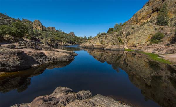 Pinnacles National Park - NPS (4/27/2013 - Credits: "Bear Gulch" by Owen Byrne (CC BY 2.0)[https://creativecommons.org/licenses/by/2.0/legalcode]https://www.flickr.com/photos/ojbyrne/)
