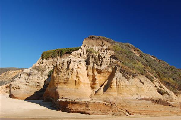 San Gregorio State Beach (SB) (1/15/2007 - Credits: "San Gregorio Sandstone" by Amanda Walker (CC BY 2.0)[https://creativecommons.org/licenses/by/2.0/legalcode]https://www.flickr.com/photos/amanda_walker/)