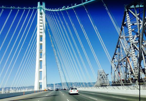 San Francisco-Oakland Bay Bridge - Highway 80 - Pedestrian Walkway & Bike Path (7/5/2014 - Credits: "The New San Francisco-Oakland Bay Bridge" by Clotee Allochuku (CC BY 2.0)[https://creativecommons.org/licenses/by/2.0/legalcode]https://www.flickr.com/photos/clotee_allochuku/)