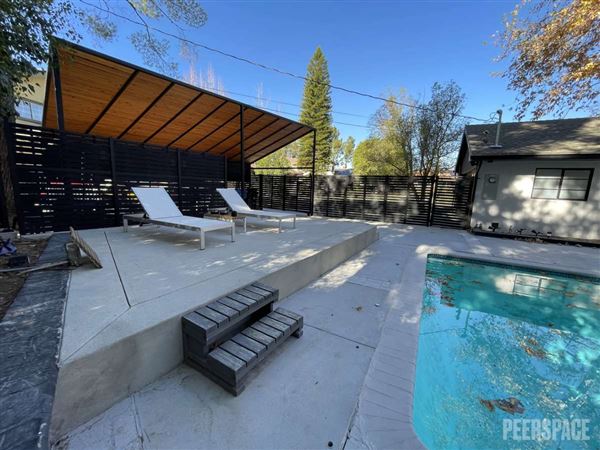 Unique Mid-Century Modern Home on 11,000 SF Corner Lot with Large Swimming Pool (11/22/2024 - Credits: Natalie Tarpinian)