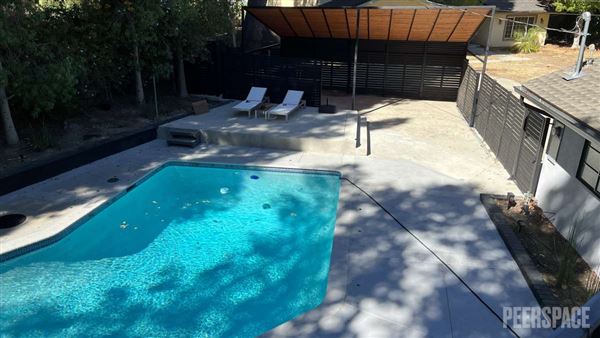 Unique Mid-Century Modern Home on 11,000 SF Corner Lot with Large Swimming Pool (11/22/2024 - Credits: Natalie Tarpinian)