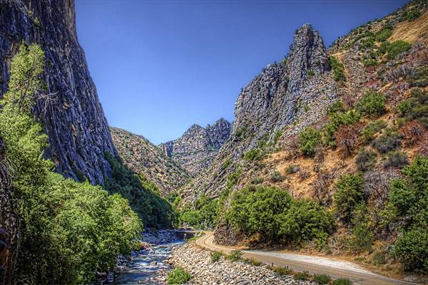 Sequoia and Kings Canyon National Parks & Crystal Cave (8/15/2012 - Credits: "King's Canyon" by Charlie Essers (CC BY-NC 2.0)[https://creativecommons.org/licenses/by-nc/2.0/legalcode]https://www.flickr.com/photos/avcellshots/)